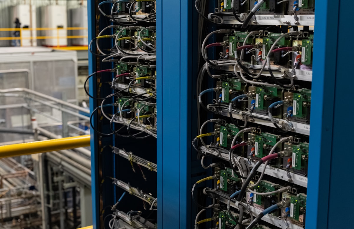 Server racks packed with boards and cabling in a facility