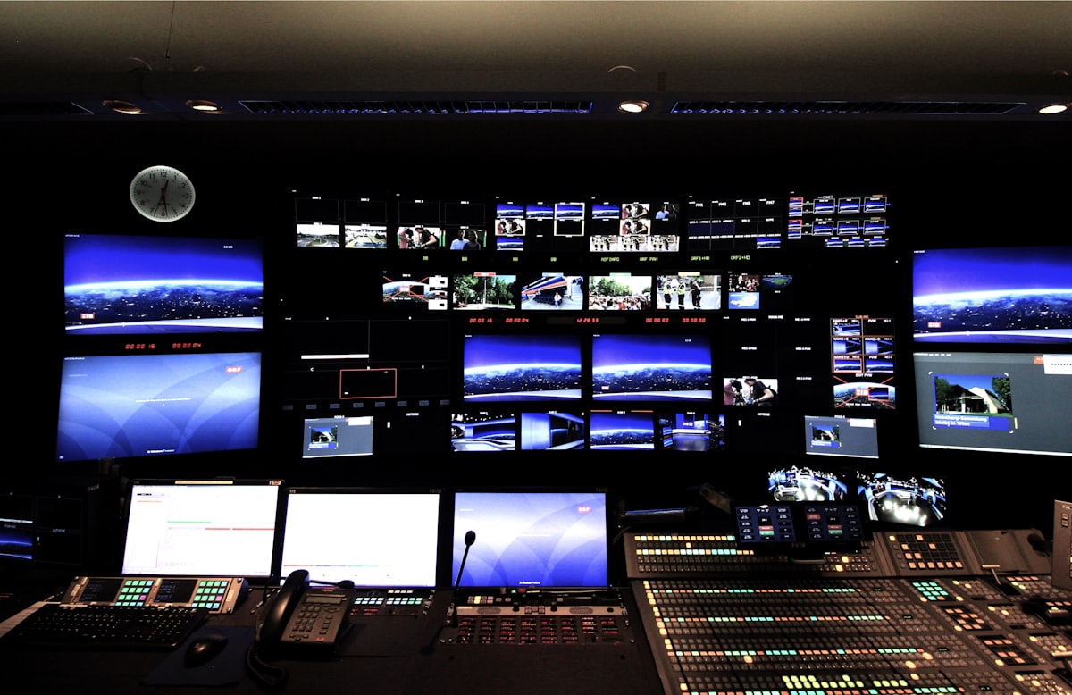 A wall of monitoring displays in a security operations room
