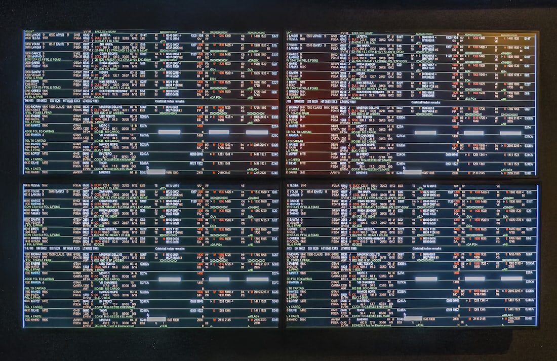 A large status board tracking data feeds across systems