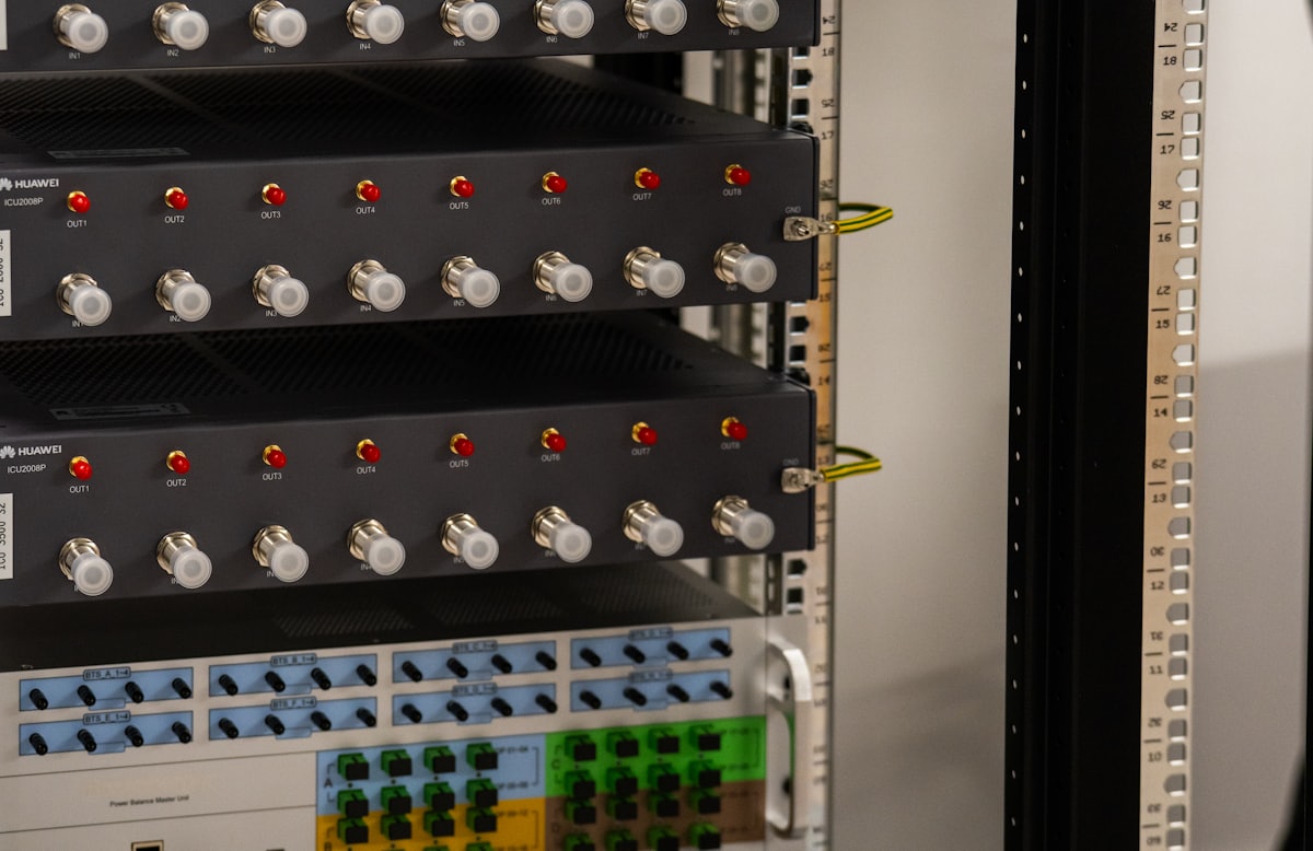 Fibre and network ports across a telecoms equipment rack